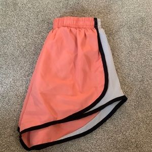 Peach colored athletic shorts